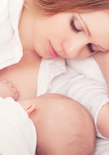 http://www.dreamstime.com/royalty-free-stock-photos-mother-feeding-her-baby-bed-sleeping-together-image29098268